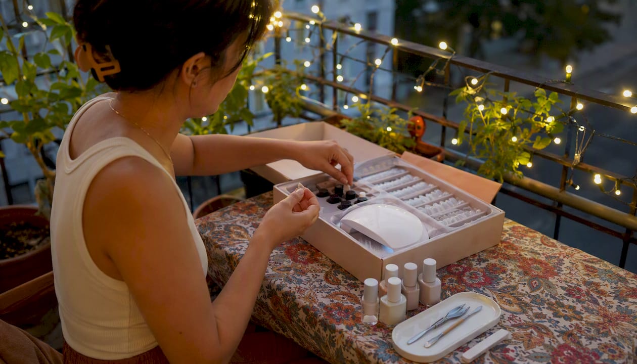 Woman arranging DIY Gel X kit at home