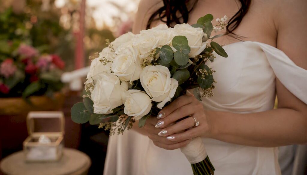 Close-up of bridal pearl chrome gel nails
