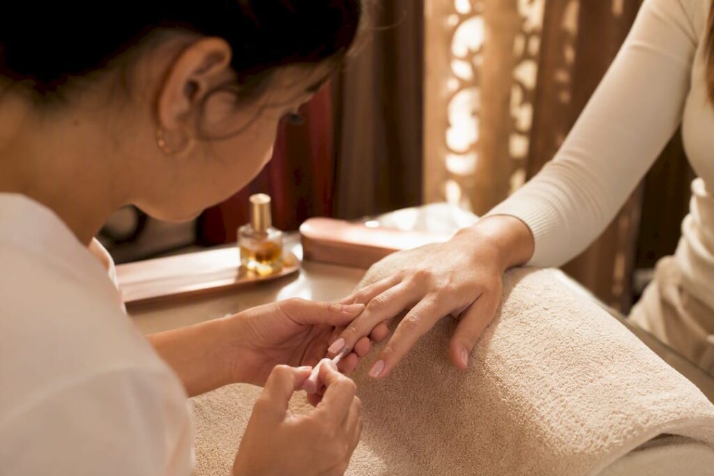 Close-up of nail polish application on hand