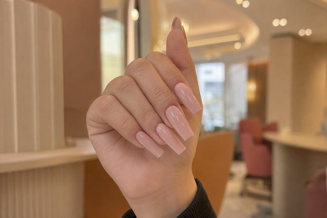 Hand with coffin shaped nails close-up