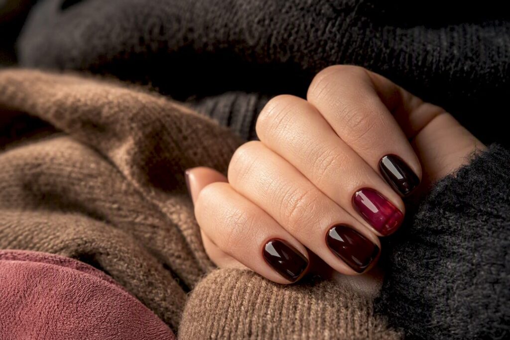 Fall manicure beside warm knit fabrics